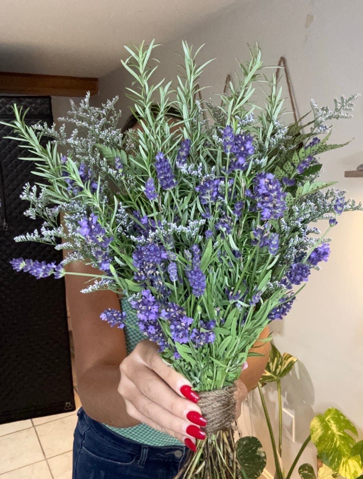Hand-tied bundle of fresh lavender, rosemary and statice wrapped in twine